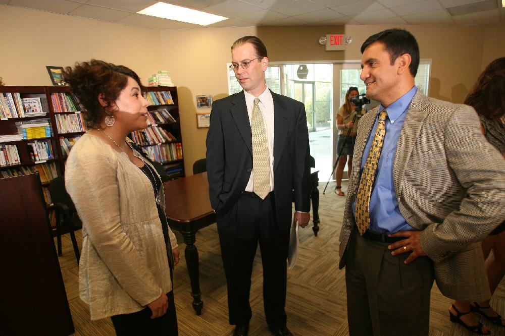 Arkansas Democrat-Gazette/RYAN MCGEENEY --06-25-2012-- Arkansas United Community Coalition executive director Mireya Reith, left, attorney Charles M. Kester, center, and Rogers/Lowell Chamber of Commerce vice president of minority business development Geovanny Sarmiento, right, chat after a press conference Monday afternoon at the Family Resource Center in Springdale. Minority community leaders from Northwest Arkansas held a press conference to respond to the U.S. Supreme Court's  decision rejecting key portions of Arizona's immigration law.