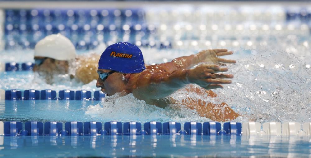 Ryan Lochte, right, and Michael Phelps compete in the men's 400-meter individual medley final at the U.S. Olympic swimming trials, Monday, June 25, 2012, in Omaha, Neb. (AP Photo/David Phillip)