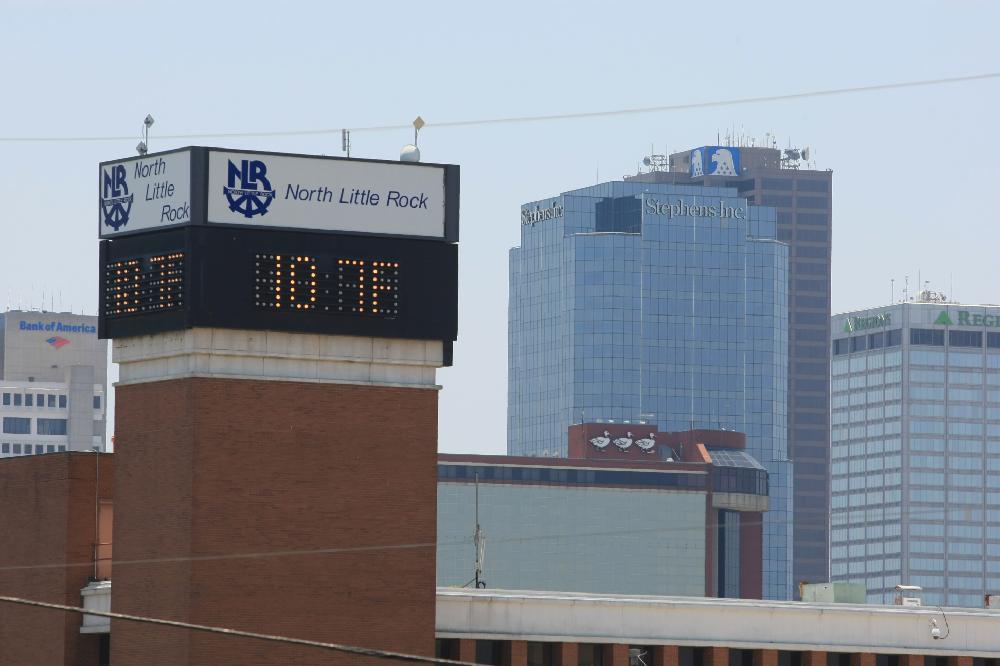 Arkansas Democrat-Gazette/RICK MCFARLAND --06/25/12-- The temperature display reads 107 degrees atop the North Little Rock Services building with Little Rock in the background Monday.