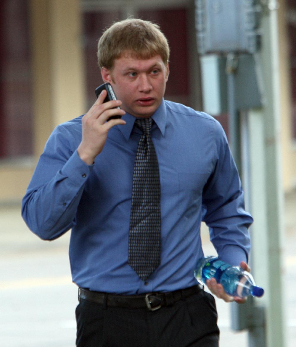 4/21/10
Arkansas Democrat-Gazette/STEPHEN B. THORNTON
Kevin Jones talks on the phone as he walks into the Johnson County Courthouse in Clarksville Wednesday morning to testify in the murder trial of Gary Dunn