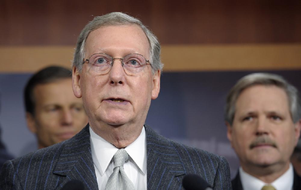 Senate Minority Leader Mitch McConnell of Ky., accompanied by  Sen. John Thune, R-S.D., left, and Sen. John Hoeven, R-N.D., speaks during a news conference on Capitol Hill in Washington, Wednesday, Nov. 30, 2011, to discuss the Keystone pipeline.  (AP Photo/Susan Walsh)