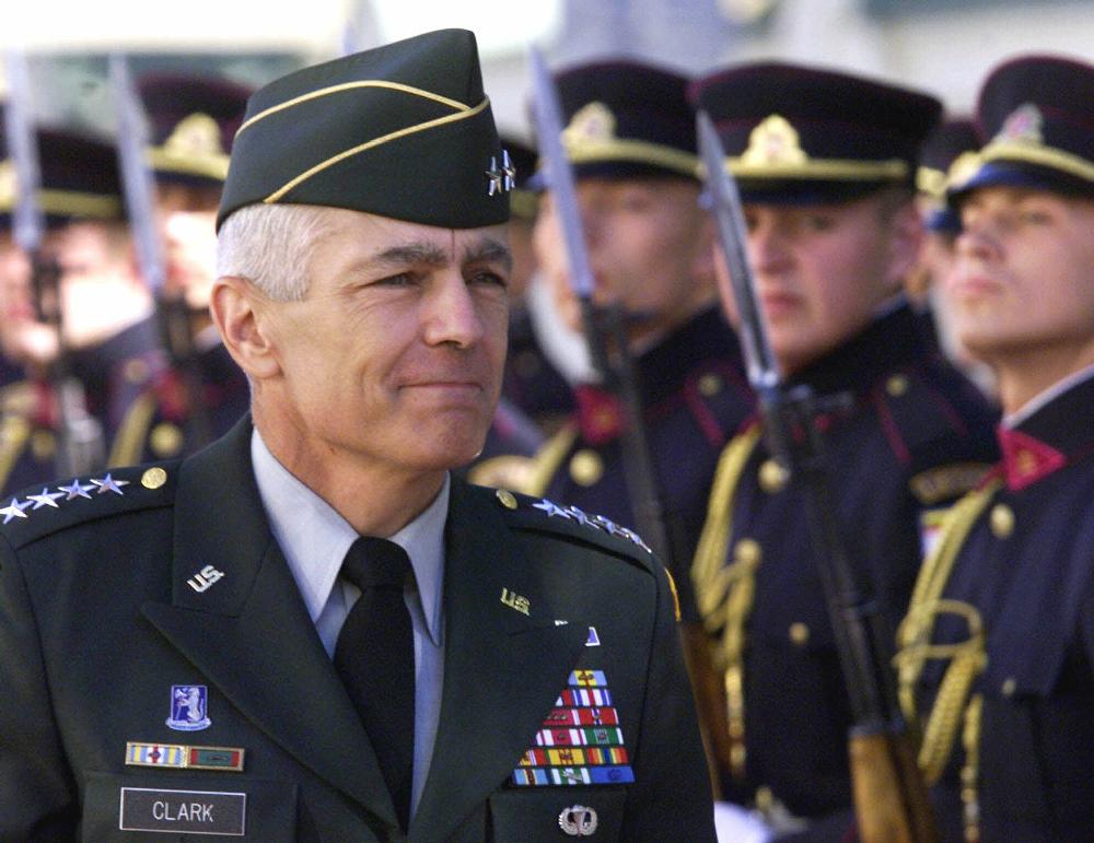 NATO's supreme commander Gen. Wesley Clark passes an honour guard in the Lithuanian capital Vilnius, Wednesday, July 28, 1999. The Clinton administration has told Gen. Wesley Clark, the American commander who led the successful NATO bombing campaign against Yugoslavia, to give up his command two months early next year.  ``When a soldier's journey is over, it's over,'' Clark, said Wednesday. He described the action as a routine staff change. (AP Photo/Mindaugas Kulbis)