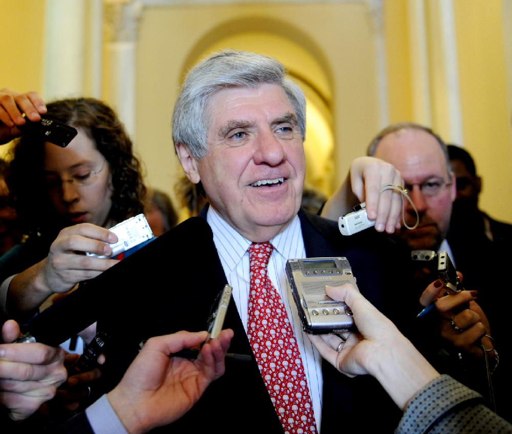 FILE - In this file Feb. 11, 2009 file photo, Sen. Ben Nelson, D-Neb. talks to reporters on Capitol Hill in Washington. Sources say Nelson will retire. (AP Photo/Susan Walsh, File)
