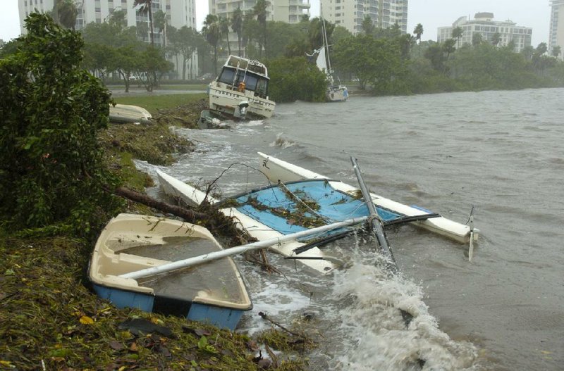 Several boats were pushed onto shore at Bayfront Park after they broke loose from their moorings in downtown Sarasota, Fla., on Monday as Tropical Storm Debby lingered off shore. 