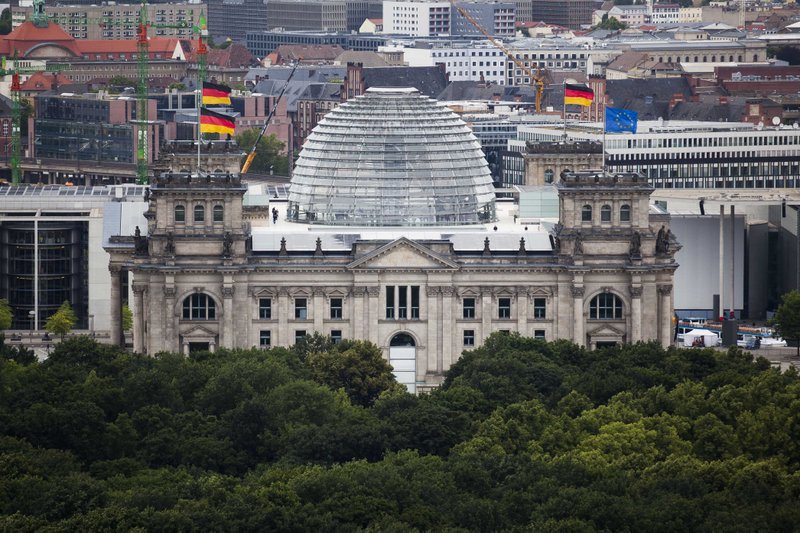 The Reichstag building, house of German parliament Bundestag in Berlin, Tuesday, June 26, 2012. German parliament will vote on the European Stability Mechanism, ESM, and the EU fiscal compact on Friday, June 29.