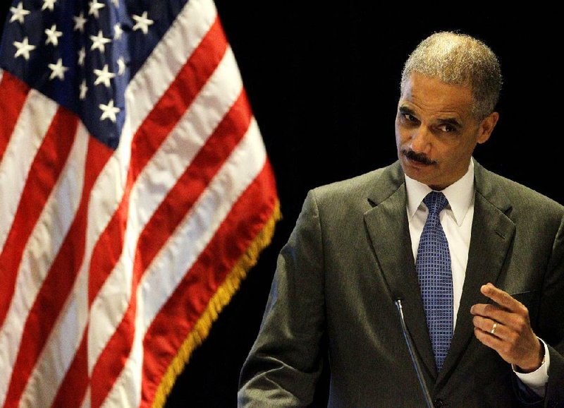 U.S. Attorney General Eric Holder gestures while speaking at the "Protecting Civil Rights: A Symposium on Key Civil Rights Issues" in Boston, Tuesday, June 26, 2012. With a vote looming to hold Holder in contempt of Congress, a House committee chairman is challenging President Barack Obama's claim of executive privilege, invoked to maintain secrecy for some documents related to a failed gun-tracking operation.  (AP Photo/Stephan Savoia)