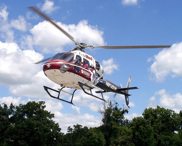 An EagleMed helicopter lifts off from Ozarks Community Hospital in Gravette on Friday after state EMS certification. Three regional helicopters were brought to Gravette for the Arkansas inspections.