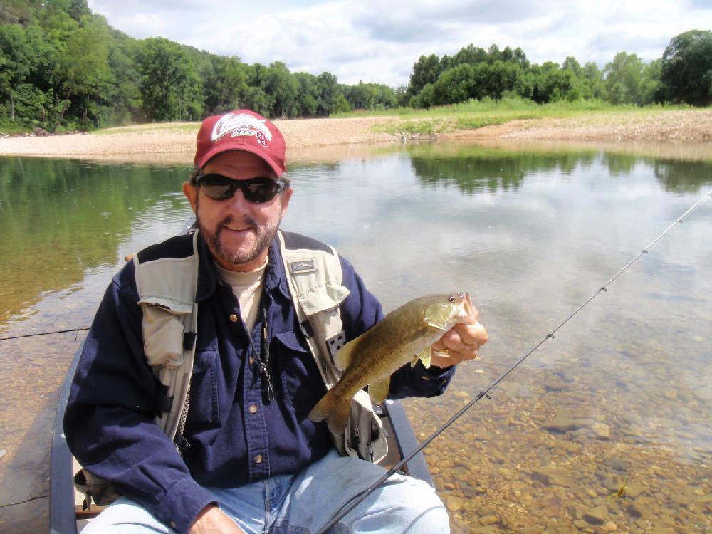 Tonkinson shows an Elk River smallmouth of a typical size caught on the float trip.