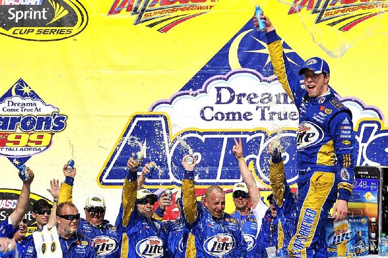 Brad Keselowski poses for photographers in victory lane after winning the NASCAR Sprint Cup Series auto race at Talladega Superspeedway, Sunday, May 6, 2012, in Talladega, Ala. (AP Photo/Autostock, Brian Czobat) MANDATORY CREDIT