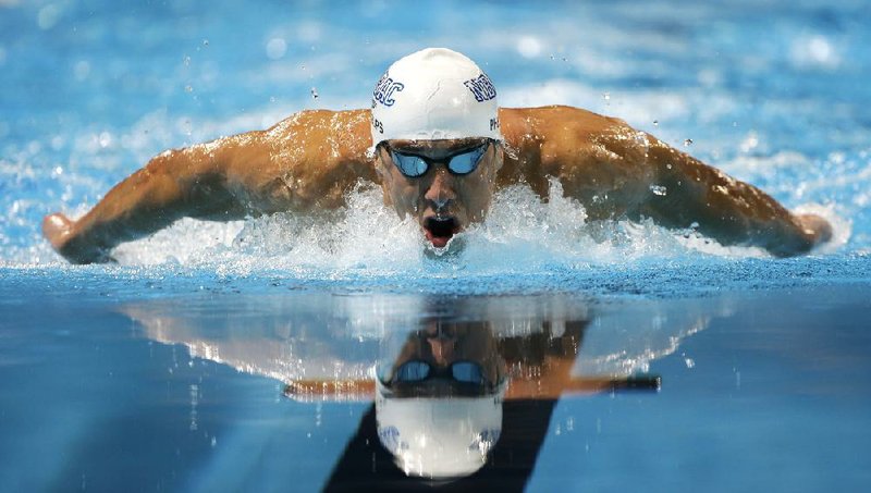 Michael Phelps pulled away for a dominating victory in the 200-meter butterfly at the U.S. Olympic trials Thursday in Omaha, Neb., keeping him on course to swim eight events in London. 