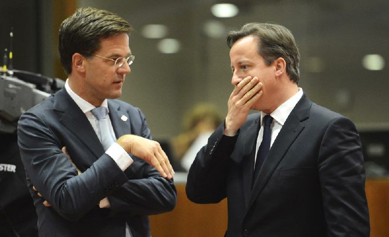 British Prime Minister David Cameron (right) speaks Thursday with Dutch Prime Minister Mark Rutte at a European Union summit in Brussels. 