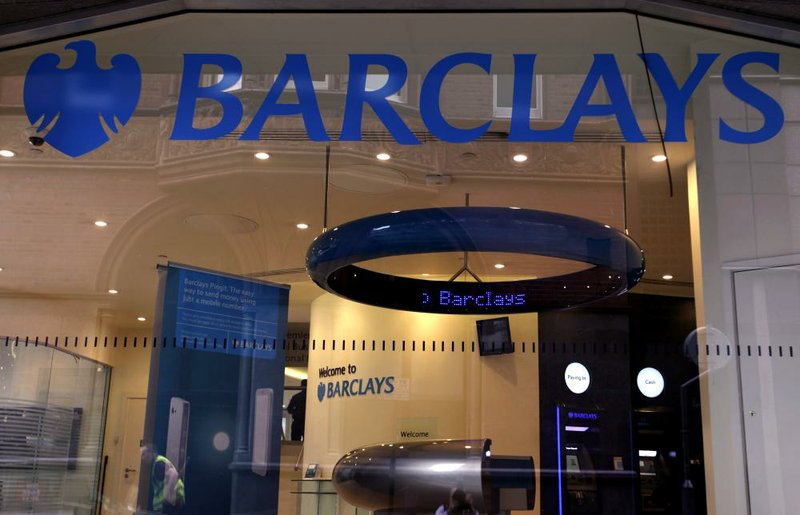 The Barclays PLC logo is seen Friday on the window of a bank branch in London. Barclays Chief Executive Officer Bob Diamond admitted in a letter to a British government committee that the bank submitted false data on borrowing costs. 