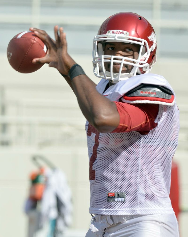 Arkansas backup quarterback Brandon Mitchell picked up where former teammate Jerry Franklin left off by interning at the Yvonne Richardson Community Center. 