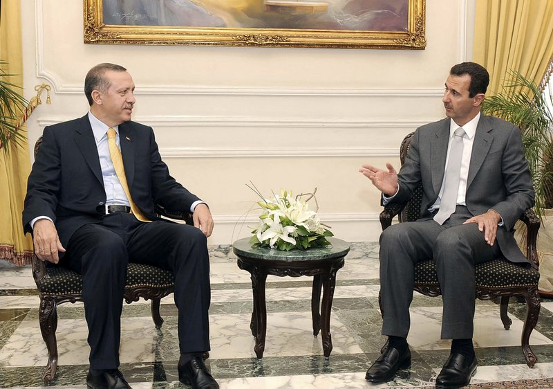 In this Wednesday, July 22, 2009 file photo released by the Syrian official news agency SANA, Syrian President Bashar Assad, right, meets with Turkish Prime Minister Recep Tayyip Erdogan in the northern city of Aleppo, Syria. Syrian President Bashar Assad said he regrets the shooting down of a Turkish jet by his forces, and that he will not allow tensions between the two neighbors to deteriorate into an "armed conflict," a Turkish newspaper reported Tuesday, July 3, 2012. 