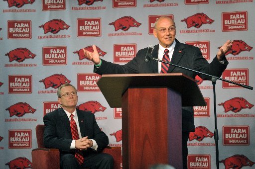 Arkansas football coach John L. Smith is making plans to declare bankruptcy. 
