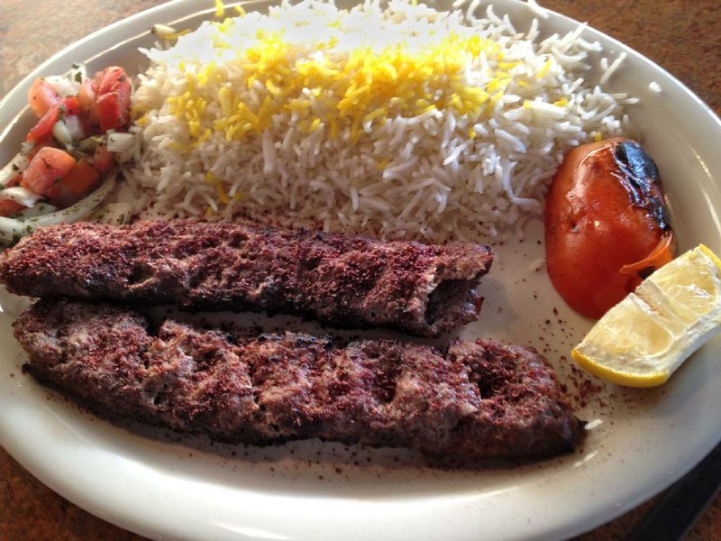 Kubeidah Kabab with basmati rice, Shrazi salad and half a pear tomato are served at Aladdin’s Persian and Mexican Grill. 