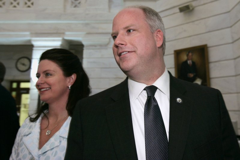 FILE - In this March 4, 2010, file photo Arkansas Attorney General Dustin McDaniel, right, and his wife, Bobbi, walk through the state Capitol in Little Rock after he filed for re-election. 