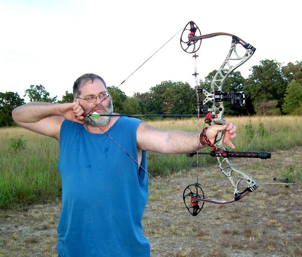 Ken Foeppel, of Centerton, took careful aim while practicing on the outdoor range Monday evening.