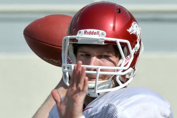 University of Arkansas quarterback Tyler Wilson runs drills during practice Tuesday afternoon at Razorback Stadium in Fayetteville.