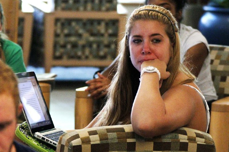 Penn State freshman Jessica Knoll cries while listening to Thursday’s news conference in which Louis Freeh said former coach Joe Paterno and others hid allegations of child sex abuse on campus. 