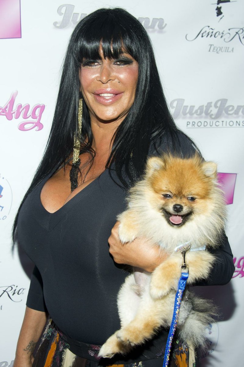 Angela Raiola, known as Big Ang, and her dog Little Louie arrive to the premiere of her VH1 reality show Big Ang. 