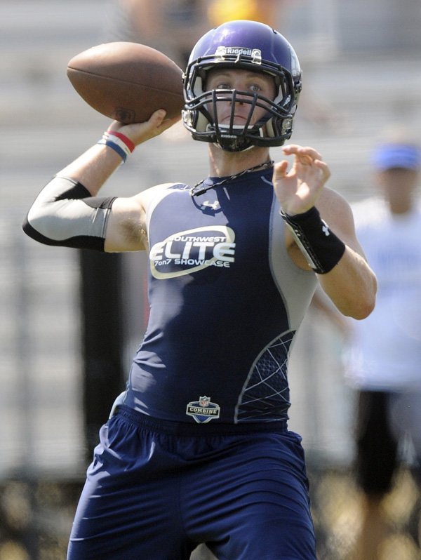 Austin Allen, Fayetteville quarterback, passes the ball Friday during the Bulldogs’ game against Bolivar, Mo., in the Southwest Elite 7-on-7 Showcase at Champions Stadium in Springdale. 