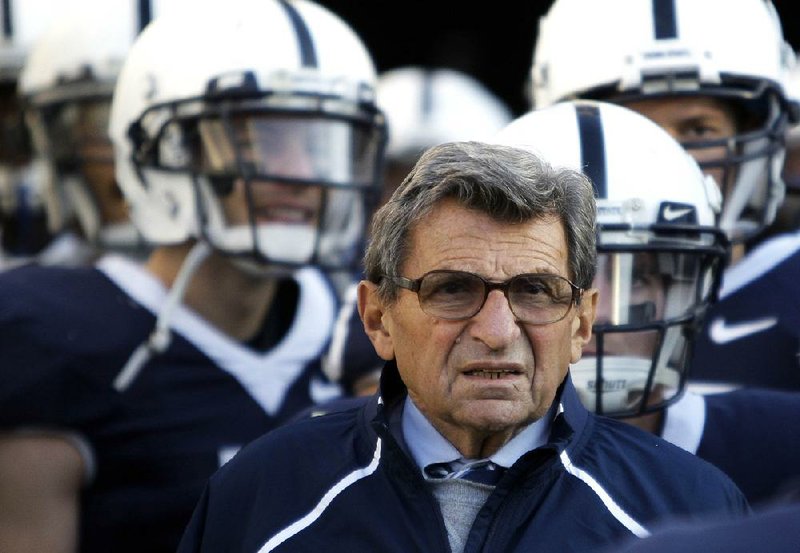 FILE - In this Nov. 7, 2009, file photo, Penn State Coach Joe Paterno stands with his players before taking the field for an NCAA college football game against Ohio State in State College, Pa. Paterno and other senior Penn State officials "concealed critical facts" about Jerry Sandusky's child abuse because they were worried about bad publicity, according to an internal investigation into the scandal released Thursday, July 12, 2012. (AP Photo/Carolyn Kaster, File)