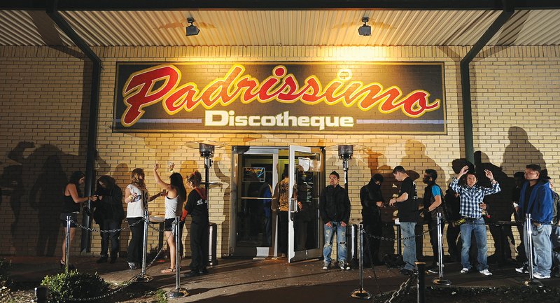 Padrissimo Discotheque customers wait in line March 3 before being searched for weapon in Tontitown. The state’s Alcoholic Beverage Control Board voted Wednesday to suspends the club’s license to sell alcohol.