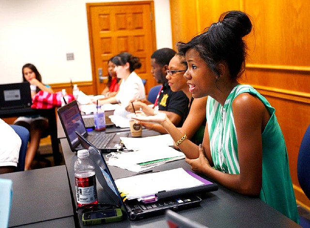 Arkansas Democrat-Gazette/JASON IVESTER --07/19/12--
Kyndal Powell-Hicks, a student at Oakwood University, responds to a question during a course for pre-law students from other universities who are participating in the School of Law's DiscoverLaw.org Prelaw Undergraduate Scholars (PLUS) Program inside Waterman Hall on the Fayetteville campus for the University of Arkansas on Thursday, July 19, 2012.