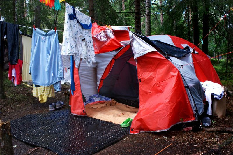 Laundry hangs on lines Friday outside the tented home of a Gypsy in an encampment near Oslo. An influx of Gypsies has sparked heated debate in Norway.