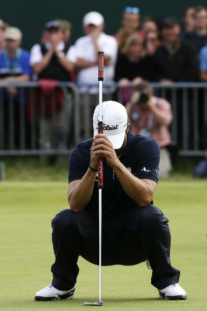 Adam Scott of Australia reacts after missing a 10-foot par putt on the 18th green that would have forced a playoff, giving Els his fourth major title. 