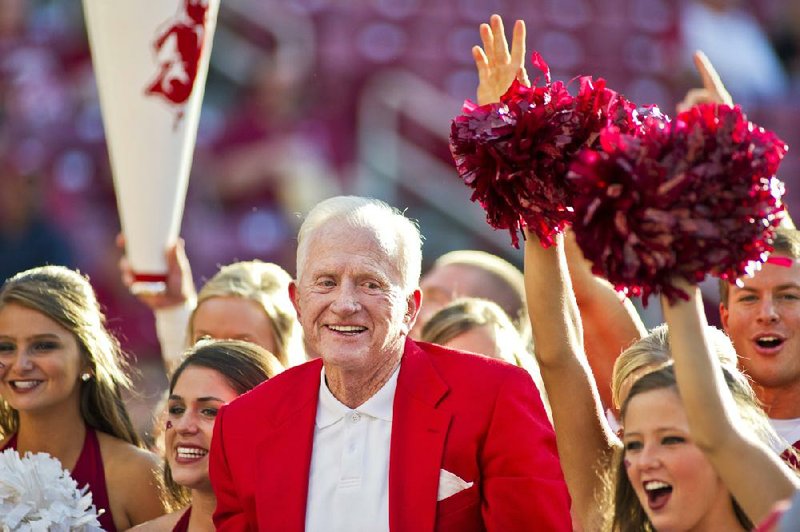 Former Arkansas athletic director Frank Broyles is shown here calling the hogs with the Arkansas spirit squad before the start of an NCAA college football game against Auburn in 2011. Frank Broyles didn’t have to be a native Arkansan to be a lifetime Arkie.