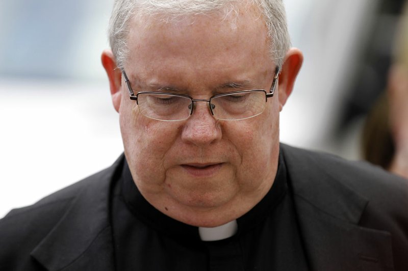 Monsignor William Lynn walks to the Criminal Justice Center before a scheduled verdict reading June 22 in Philadelphia. Lynn, who became the first U.S. church official branded a felon for covering up sex abuse claims against priests was sentenced July 24, 2012, to three to six years in prison.