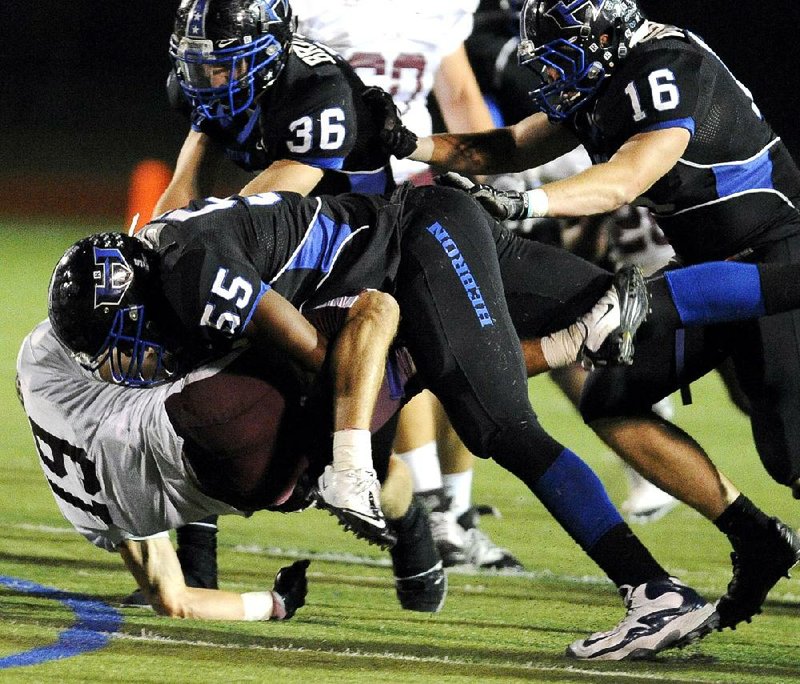 In his senior season at Carrollton (Texas) Hebron, Deatrich Wise (55) recorded 113 tackles, 10 sacks, 12 tackles for loss, 2 forced fumbles, 2 quarterback hurries and blocked a field goal. Since his arrival in Fayetteville last month, Wise has added 10-15 pounds to his 6-foot, 6-inch frame. 