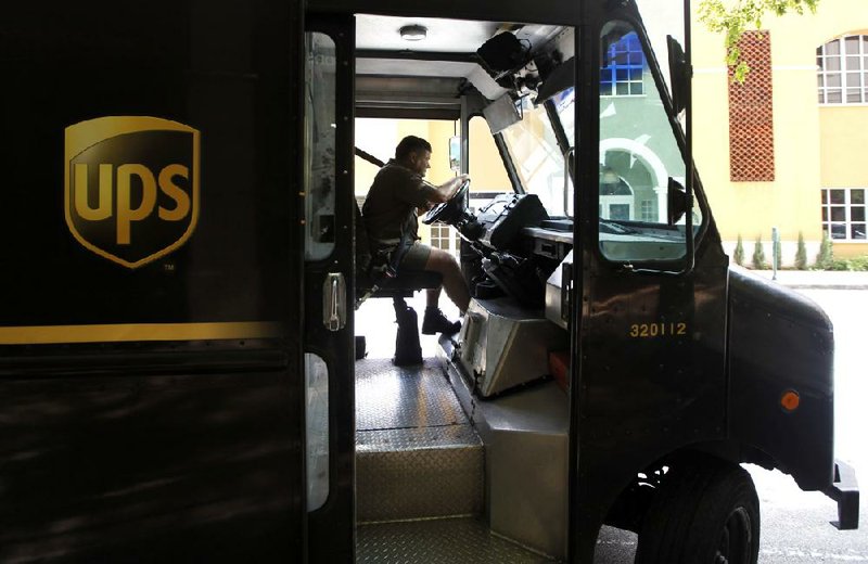 A UPS driver completes a delivery stop in Coral Gables, Fla., earlier this month. UPS said Tuesday that it expects the U.S. economy will grow just 1 percent this year. 
