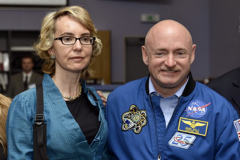 Former U.S. Rep. Gabrielle Giffords and her husband, Mark Kelly, NASA astronaut and commander of mission STS-134, visit the Alpha Magnetic Spectrometer Payload Operations and Command Center at the European Organization for Nuclear Research (CERN) in Meyrin near Geneva on Wednesday, July 25, 2012. 