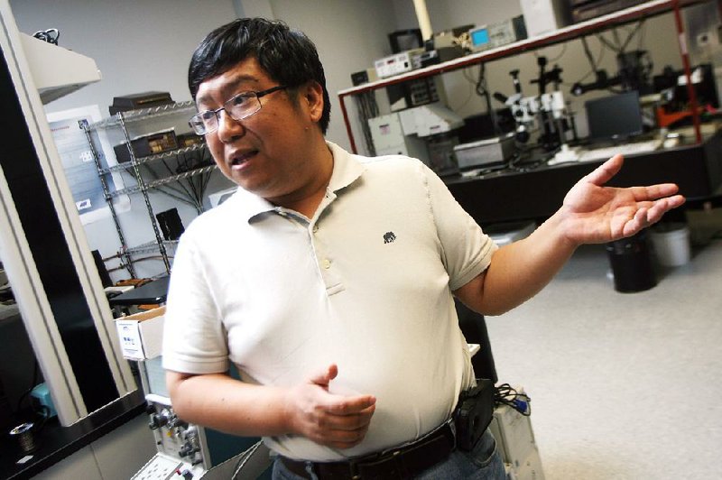 Shui-Qing “Fisher” Yu, assistant professor of electrical engineering at the University of Arkansas at Fayetteville, speaks in his lab at the UA Engineering Research Center.