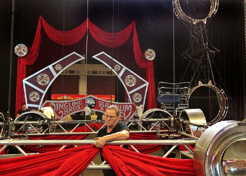 
Kat Savatinova sets up a canopy at Verizon Arena in preparation for Ringling Bros. Barnum Bash circus, which starts Thursday night at the arena and continues through Sunday. The circus features a Pre-show party an hour before each performance where audience members can interact with the circus animals and performers on the arena floor.