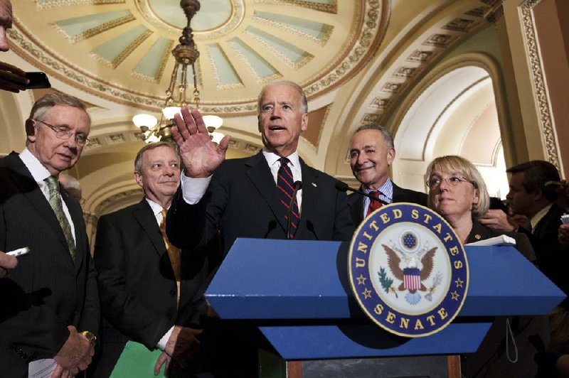 Vice President Joe Biden joins the Senate’s Democratic leadership (from left) Majority Leader Harry Reid, Richard Durbin, Charles Schumer and Patty Murray after passing the Democrats’ version of a year-long tax-cut extension Wednesday. 