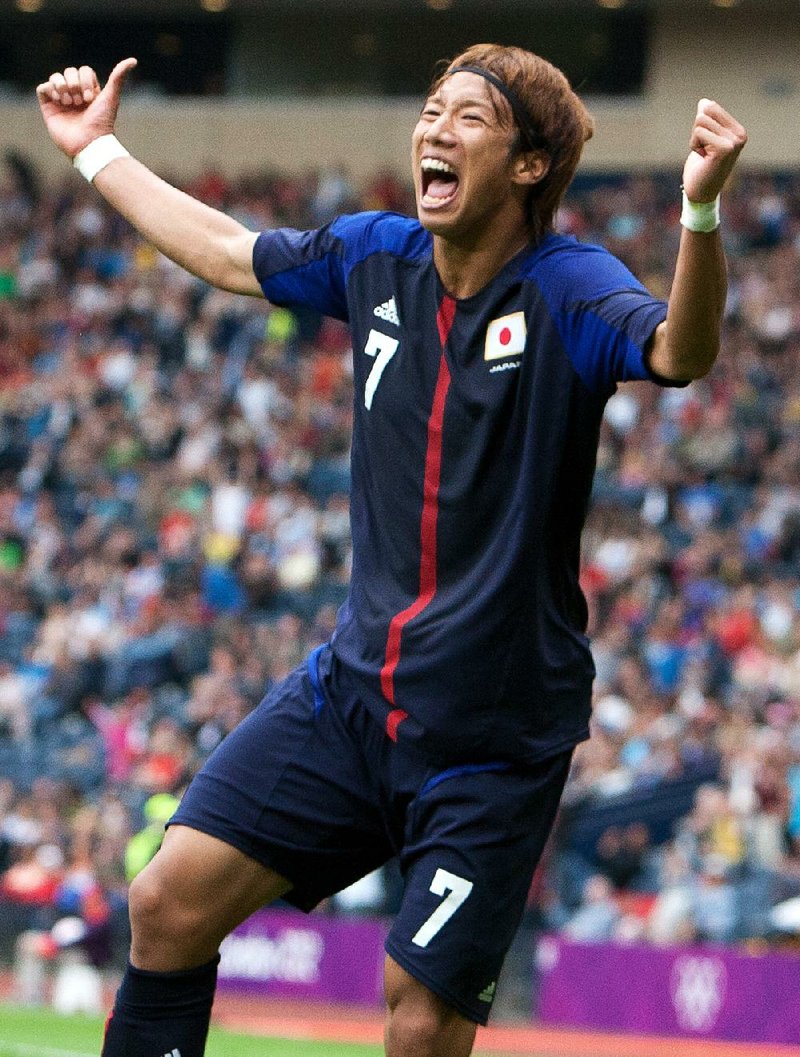 Japan’s Yuki Otsu celebrates after scoring the lone goal in a 1-0 victory over Spain on Wednesday at Hampden Park Stadium in Glasgow, Scotland. 