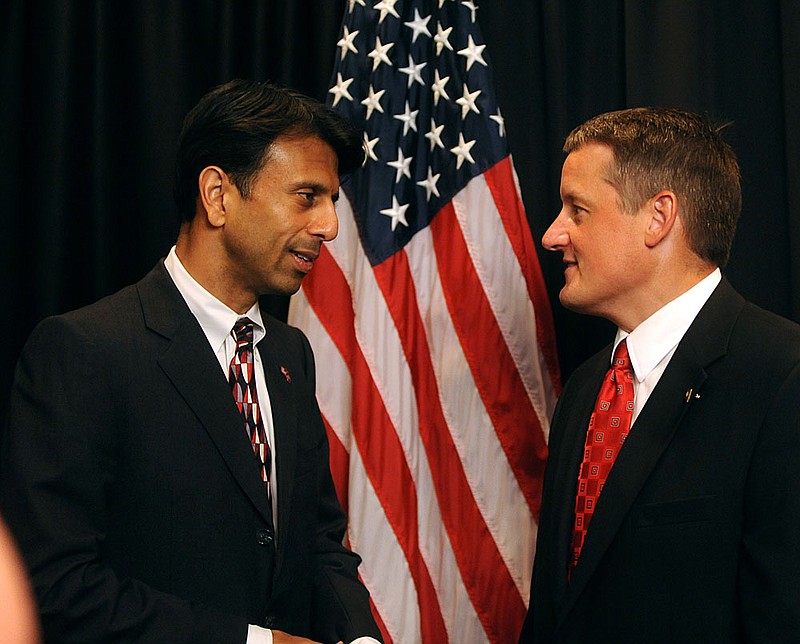 Louisiana Gov. Bobby Jindal (left) talks Friday with state Rep. Bruce Westerman before the annual Reagan-Rockefeller Dinner at the Hot Springs Convention Center. 