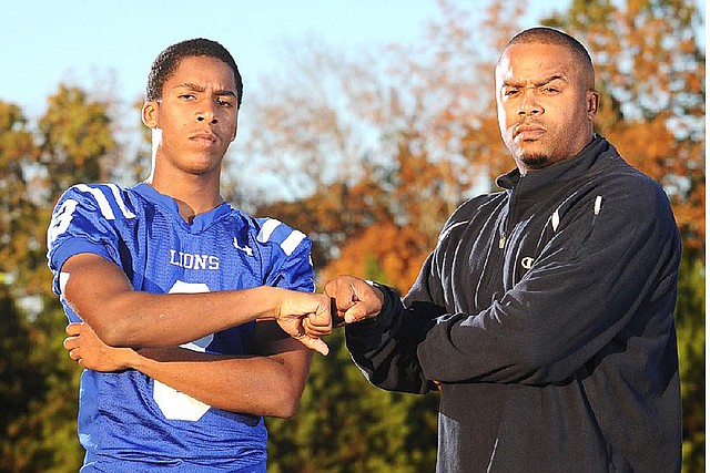 Arkansas defensive back signee Ray Buchanan Jr. (left) takes his name and his game from his father, Ray Buchanan Sr. (right). 