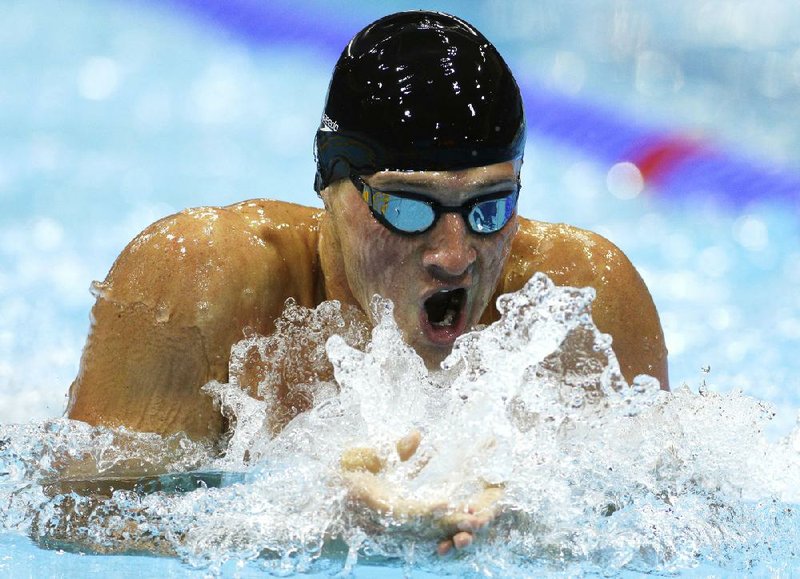 American Ryan Lochte swims the breaststroke, or third leg, of the 400-meter individual medley in the London Olympics on Saturday. Lochte, who was supposed to battle fellow American Michael Phelps in the event, finished more than four seconds ahead of Phelps, who was fourth. Video available at arkansasonline.com/videos. 