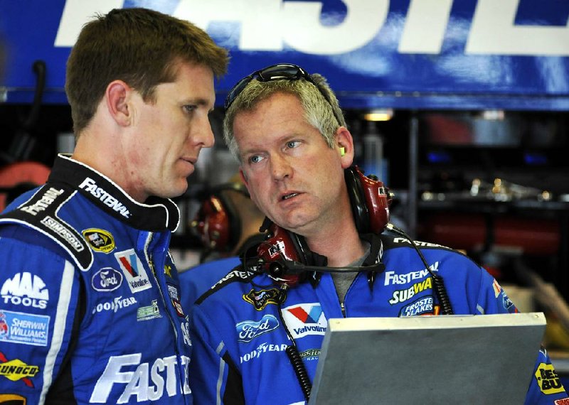 Carl Edwards says former crew chief Bob Osborne (right) has been replaced by Chad Norris because of health issues. Edwards says Osborne could return once those issues are resolved. 