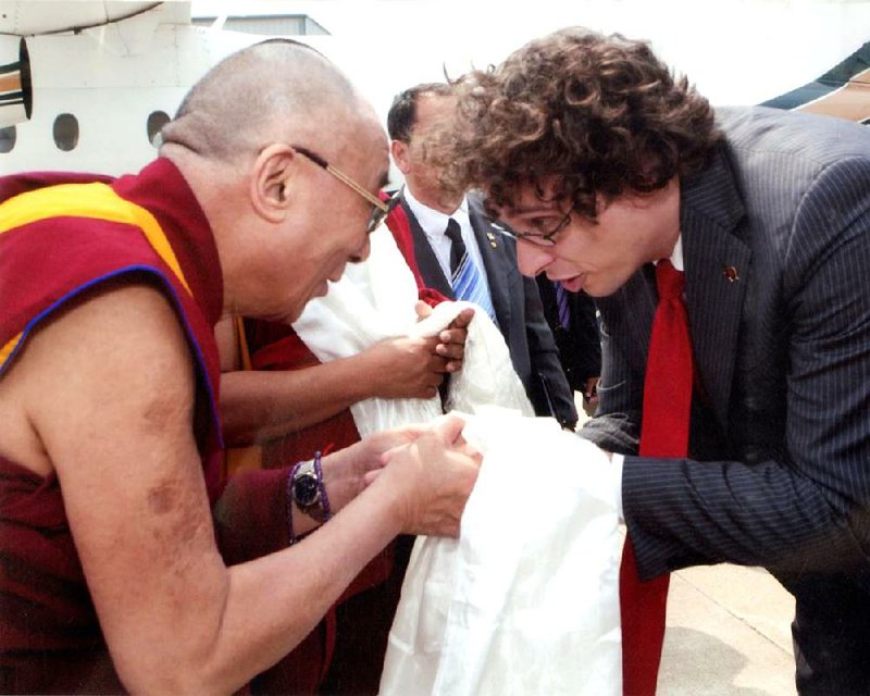 Billy Fleming speaks with the Dalai Lama on the University of Arkansas at Fayetteville campus in May 2011. 