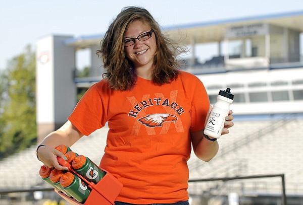 Rylee Fincher, 15, is starting her second season as a water girl for the Rogers Heritage football team. Her role of keeping her team’s players hydrated is an important one. Fincher’s brother, Kendrick Fincher, died from heatstroke in August 1995 following a junior high football practice. 