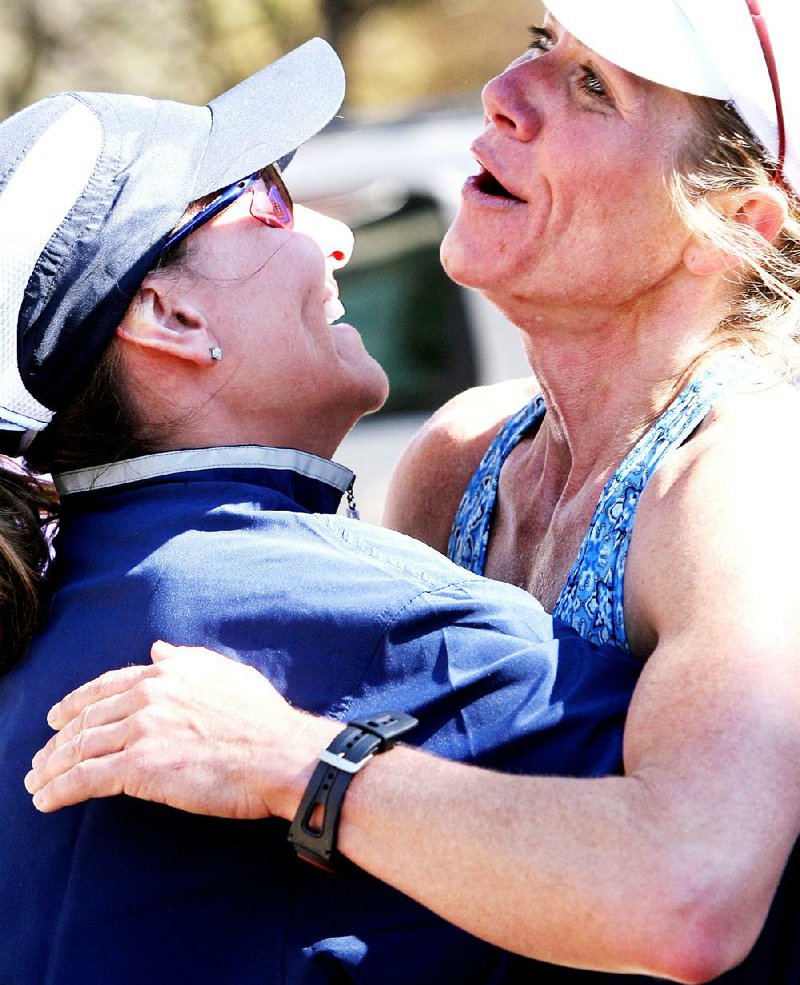 Blair Dean of Jonesboro gets a hug from her friend, Shanda Rogers, after the 2007 Hogeye Half Marathon in Fayetteville. 