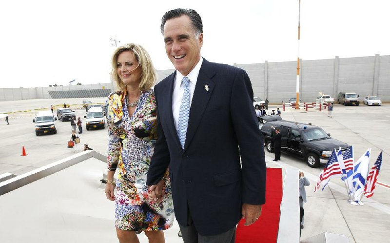 Republican presidential candidate and former Massachusetts Gov. Mitt Romney and his wife, Ann, board their charter plane Monday in Tel Aviv, Israel, headed to Poland. 