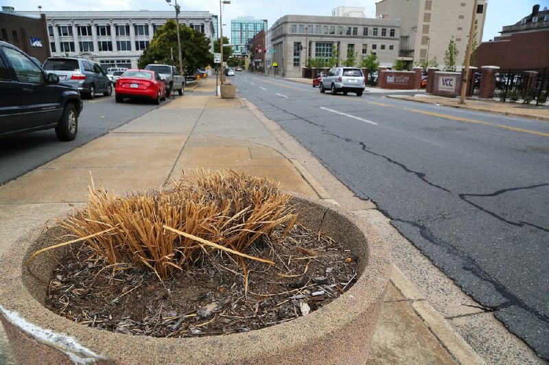 A development company said underground utility lines are snarling its plan to plant trees on its property on West Third Street between Center and Louisiana streets in Little Rock. 