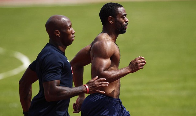 Sprinter Tyson Gay (right), shown running with training partner Trell Kimmons, has been forced to keep pushing himself to get in shape coming off his hip injury while other athletes have cut back on training in recent weeks. “I’ve tried to cram in a lot of workouts and a lot of weights in the least amount of time I could,” Gay said last week. 